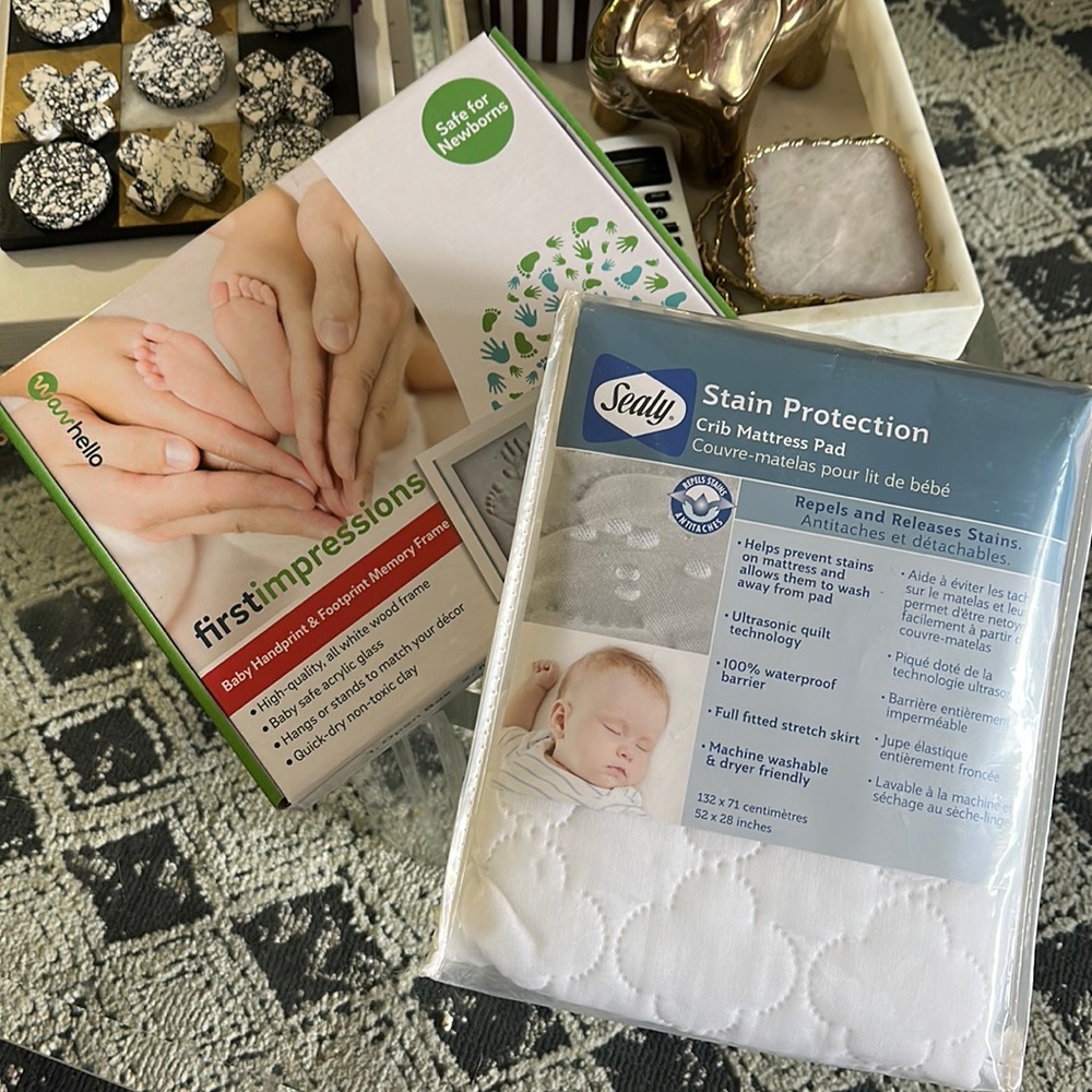 Crib mattress pad + first impressions baby handprint and footprint memory frame